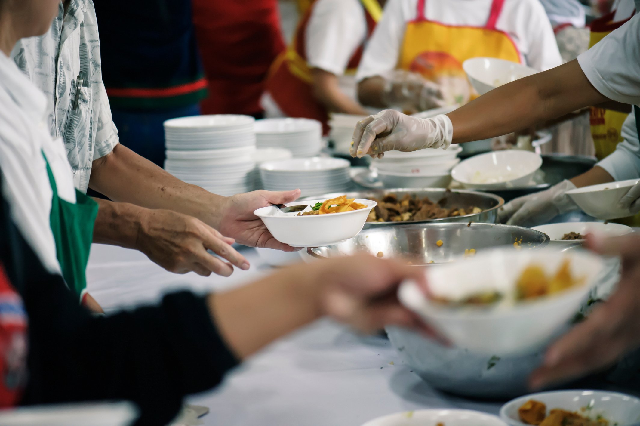 Volunteers Share Food to the Poor to Relieve Hunger: Charity concept